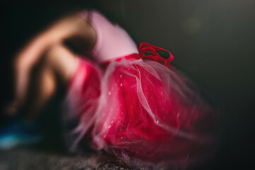 Child wearing Pink dress with ribbon tie