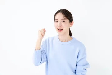 Fotobehang ガッツポーズする女性 © naka
