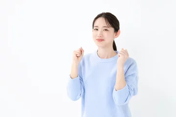 Fotobehang ガッツポーズする女性 © naka