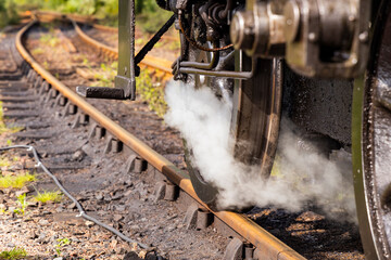 Iconic Jacobite steam train crosses Glenfinnan Viaduct and stops at the station, with historical details, smoke, and nostalgia. Timeless and magical icon in the Scottish Highlands. Locomotive interior
