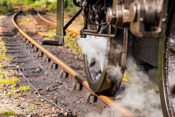 Iconic Jacobite steam train crosses Glenfinnan Viaduct and stops at the station, with historical details, smoke, and nostalgia. Timeless and magical icon in the Scottish Highlands. Locomotive interior