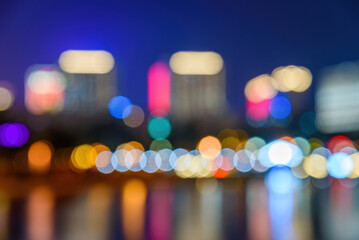 Fototapeta premium Night view of Nancheng business district in Dongguan, China. Blurred city light background.