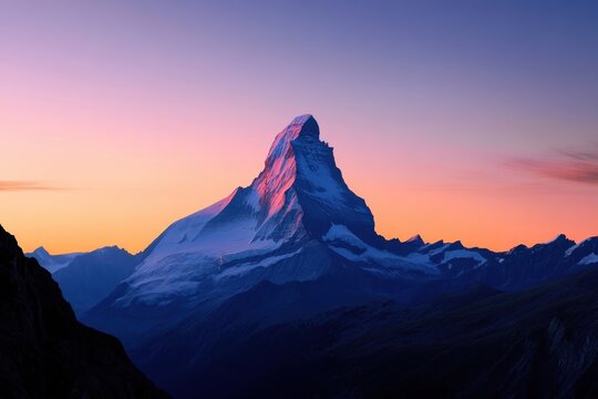 Matterhorn at sunset with vibrant colors illuminating the sky and mountain peak