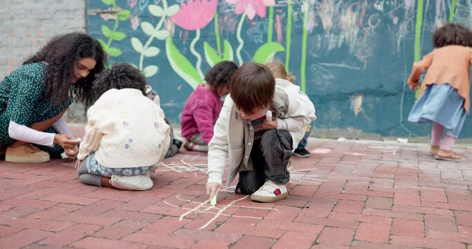 School, children and writing on playground with chalk for creative activity, fine motor skills or art lesson. Montessori, people and teacher with students for drawing patterns or learning development