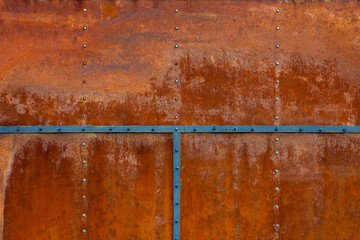 Rusty bolted metal with steel stripes, aged texture, corrosion