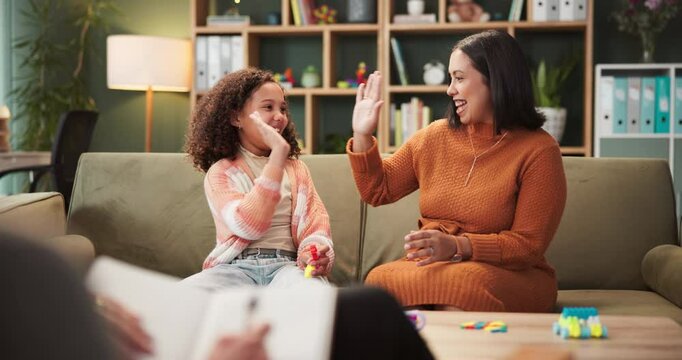 Therapy, mother and girl with high five, smile and happiness with breakthrough, consultation and recovery. Office, psychologist and family with mama, daughter and achievement with help and advice