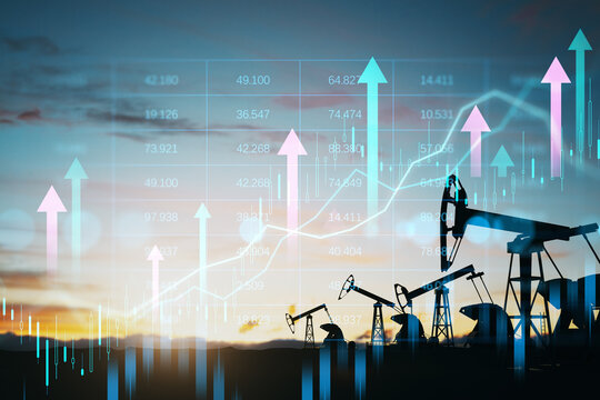 Oil pump jacks and financial chart hologram with rising arrows in double exposure concept of energy market growth and digital business trends.