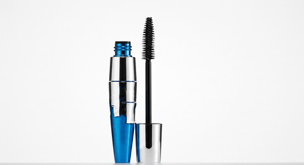 Elegant blue and silver mascara ready for application, promising a dramatic lash enhancement against a clean white backdrop.