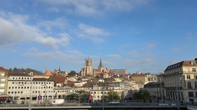 Lausanne, Switzerland, November 30, 2024: SLOW - The Cathedral of Notre Dame of Lausanne seen from Le Flon, in the canton of Vaud. It is owned by the Evangelical Reformed Church of the Canton of Vaud.
