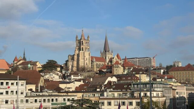 Lausanne, Switzerland, November 30, 2024: SLOW - The Cathedral of Notre Dame of Lausanne seen from Le Flon, in the canton of Vaud. It is owned by the Evangelical Reformed Church of the Canton of Vaud.