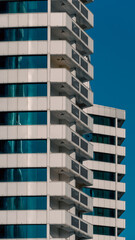 many windows and walls facade of a modern skyscraper without people
