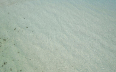 Aerial view of the white sand and clear sea water