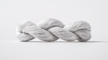Soft gray yarn twisted neatly, perfect for crafting creative projects in any setting, indoor or outdoor, at any time of the day