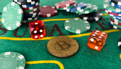 Colorful casino chips, dollars, bitcoins and red dice