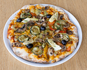 Vegetarian pizza with olives, mushrooms and bell peppers for Italian food visuals