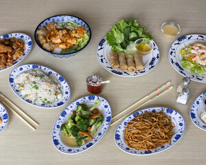 Asian food buffet with noodles, rice, spring rolls and vegetables for restaurant and delivery menu visuals