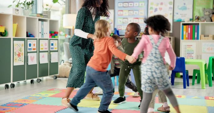 Teacher, children and holding hands in circle for playing, jumping game and fun activity in recess. Montessori, people and learning break for classroom community, motor skills and growth development