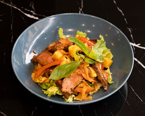 Vietnamese salad with grilled beef, shrimp, fresh vegetables and herbs for Asian healthy food visuals