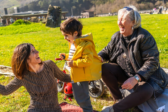 Happy family having fun outdoors in a sunny day