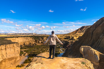 Tourist enjoying the panoramic view of bardenas reales desert in navarre, spain