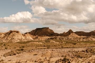 Bardenas reales desert showing eroded mountains and cloudy sky in navarre, spain