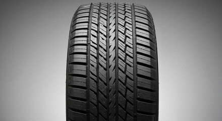 All-season tires, Close-up of an all-season tire with intricate tread design, showcasing performance features, product photography, copy space
