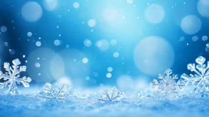 Close-up of delicate snowflakes resting on a snowy surface.  The icy blue background creates a serene winter wonderland scene.