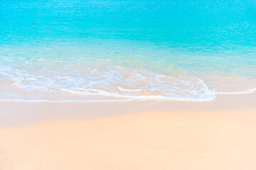 Turquoise ocean meets white beach in a summer paradise. Relaxing holiday backdrop with ocean waves.