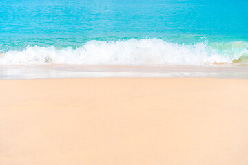Clear turquoise water and gentle waves on white sand beach. Ideal for summer vacation backgrounds.