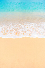 Tropical island beach with turquoise waves and white sand. Perfect summer escape background.