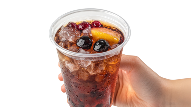 A refreshing beverage filled with ice and fruits, held in a hand against a neutral background, perfect for summer enjoyment