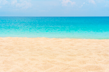 White sandy beach and turquoise waves sparkle under a sunny sky perfect vacation moment.