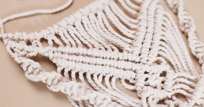 macrame and cotton threads on light background, suitable for banners and advertising of macrame and boho crafts
