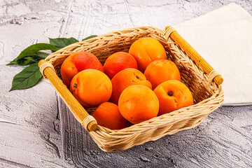 Raw ripe sweet apricots heap