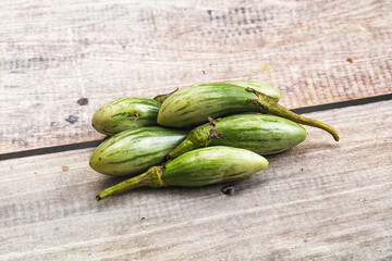 Small organic young green eggplant