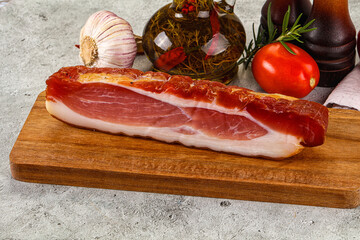 Piece prosciutto crudo over board