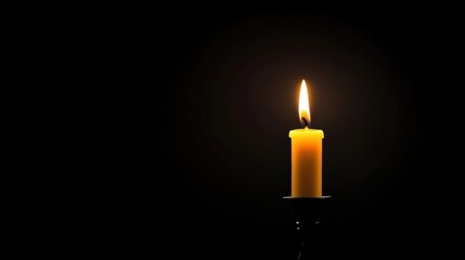 A single yellow candle illuminates a dark background.