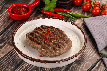 Grilled beef burger cutlet with sauce