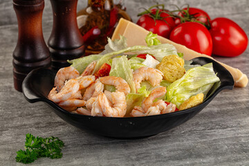 Tasty caesar salad with prawn