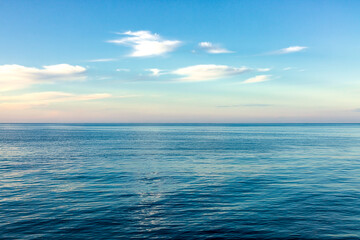 Fototapeta premium Serene Ocean View With Blue Sky And Gentle Clouds Peaceful Horizon