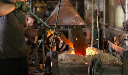 Foundry - ferrous metal is melted in an induction furnace of metallurgical plant