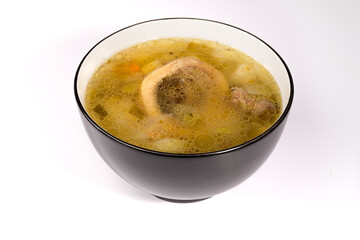 bol de soupe légumes viande de boeuf et os à moelle