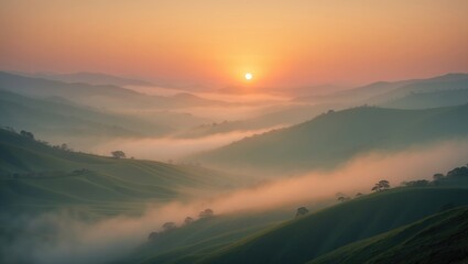 Visible silhouettes of a mountain range in colorful morning mist. Background of an orange sky. Soft focus effect.