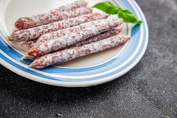 Dried sausage aperitif salami meat product natural food dish organic product fresh tasty gourmet food background on the table rustic food top view copy space