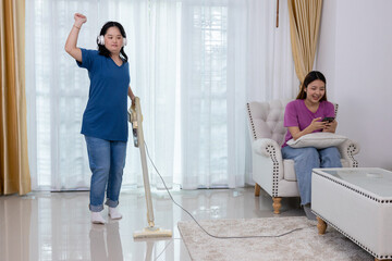 Disabled children, autism, vacuum the living room and enjoy listening to music