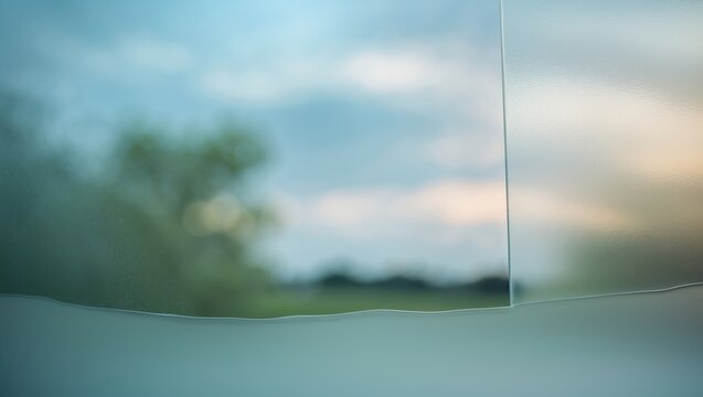 Sky behind frosted glass - Powered by Adobe