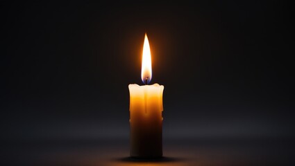 Close-up of a single candle's light and flame