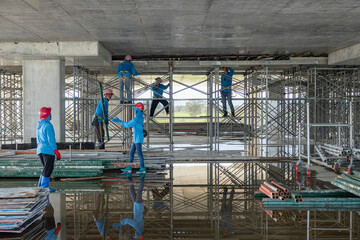Plumbing works laying CW pipes in brick walls to prepare for plastering