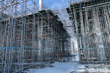 High scaffolding structure under construction beams