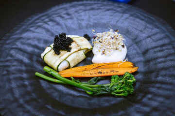 A beautifully arranged plate of delicious food featuring colorful carrots and fresh broccoli on it, showcasing a healthy meal option